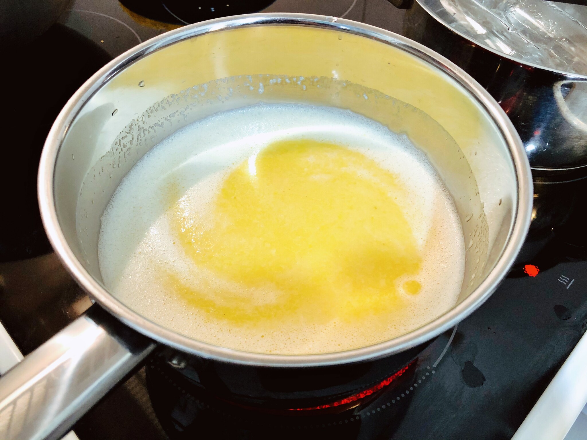 yellow sauce boiling in kettle, lemon drop